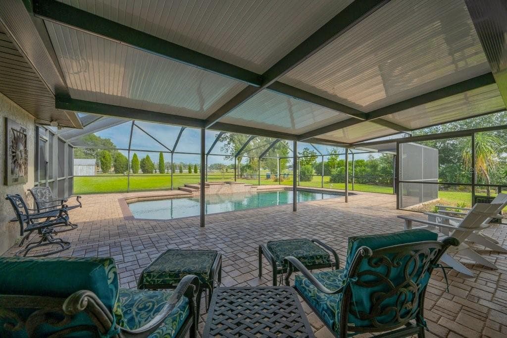 Huge pool lanai area with a great view of the back pasture. - 5710 WO GRIFFIN RD, PLANT CITY