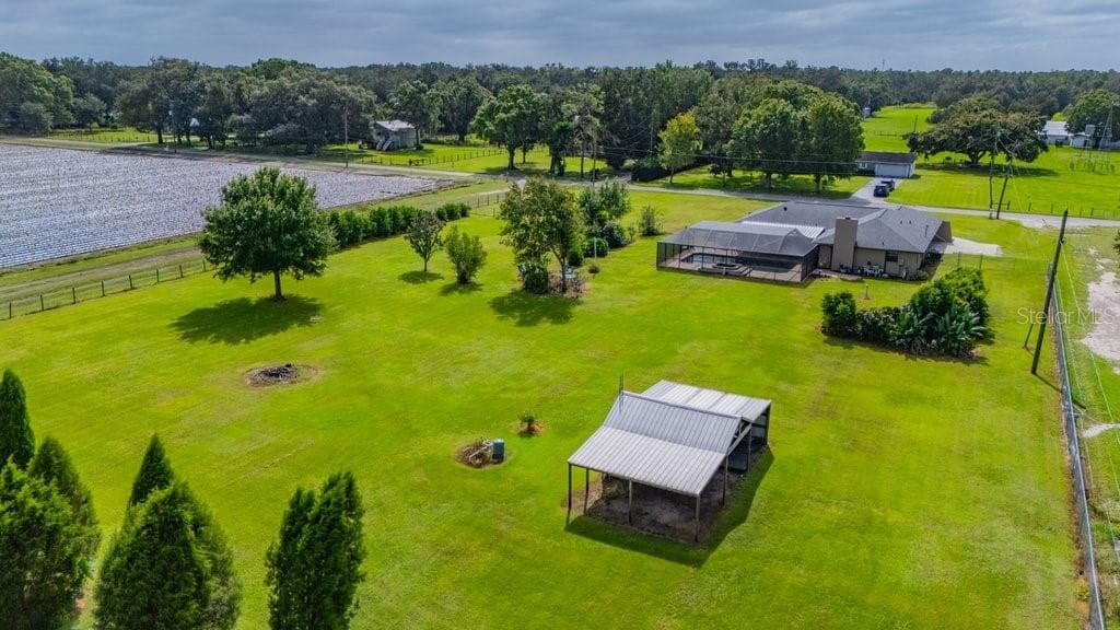 View of the pole barn and home from the back of the property - 5710 WO GRIFFIN RD, PLANT CITY