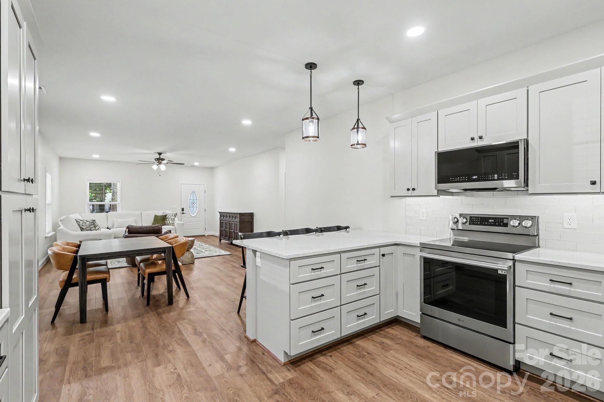 Kitchen open to dining and living room - 2121 Woodhurst Lane, Albemarle