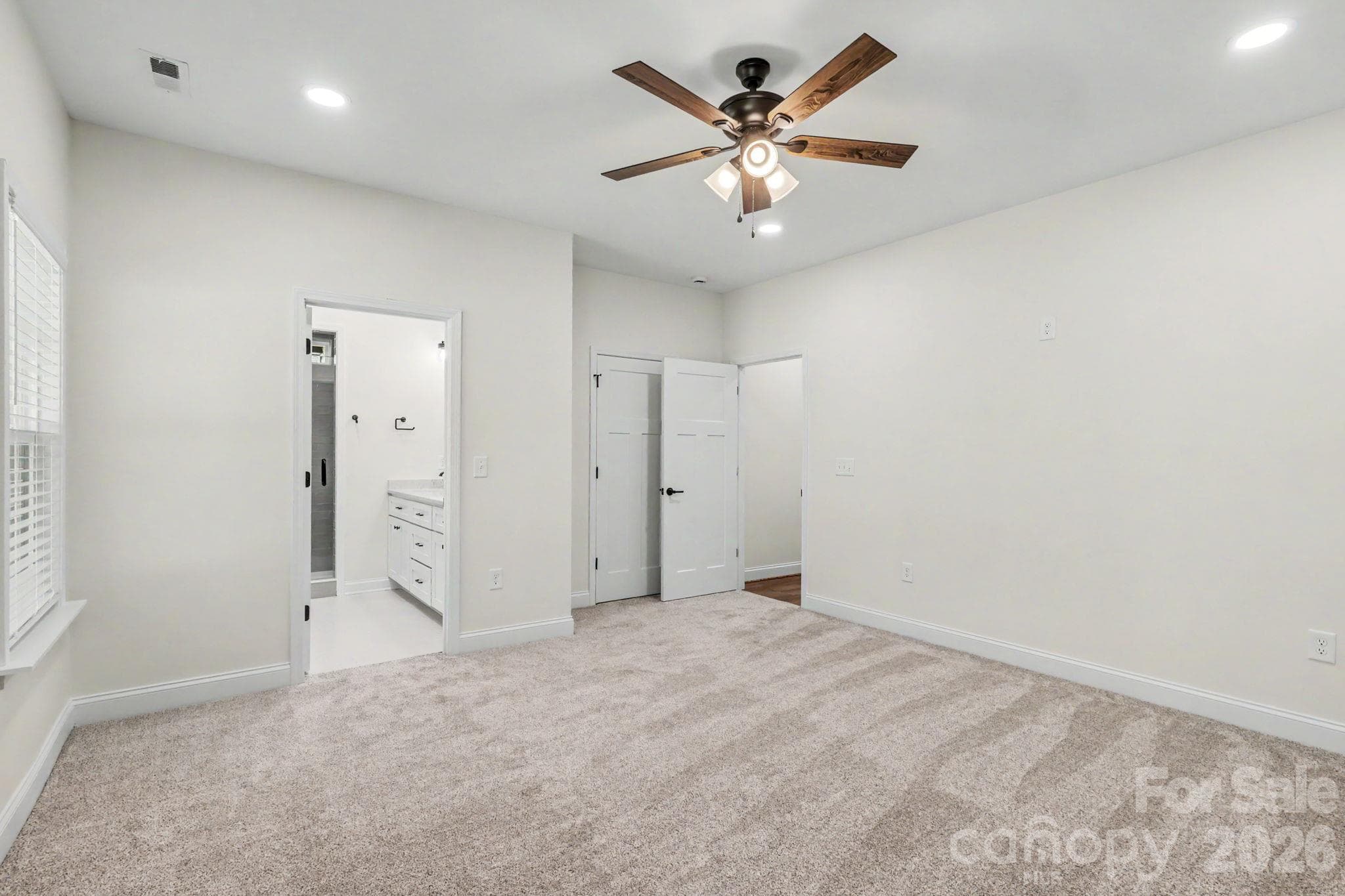 Primary Bedroom with walk-in closet and full bath - 2121 Woodhurst Lane, Albemarle