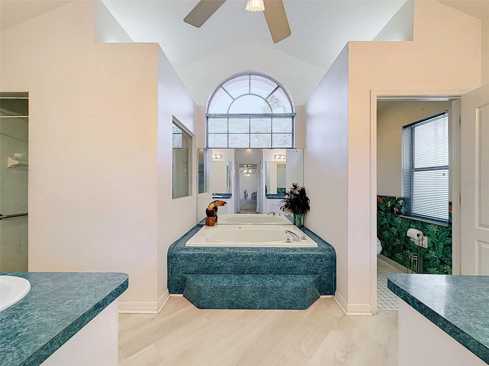 Owner's suite includes jetted tub, two WICs, linen closet, water closet, two vanities, and large shower. - 10074 SLEEPY WILLOW CT, SPRING HILL