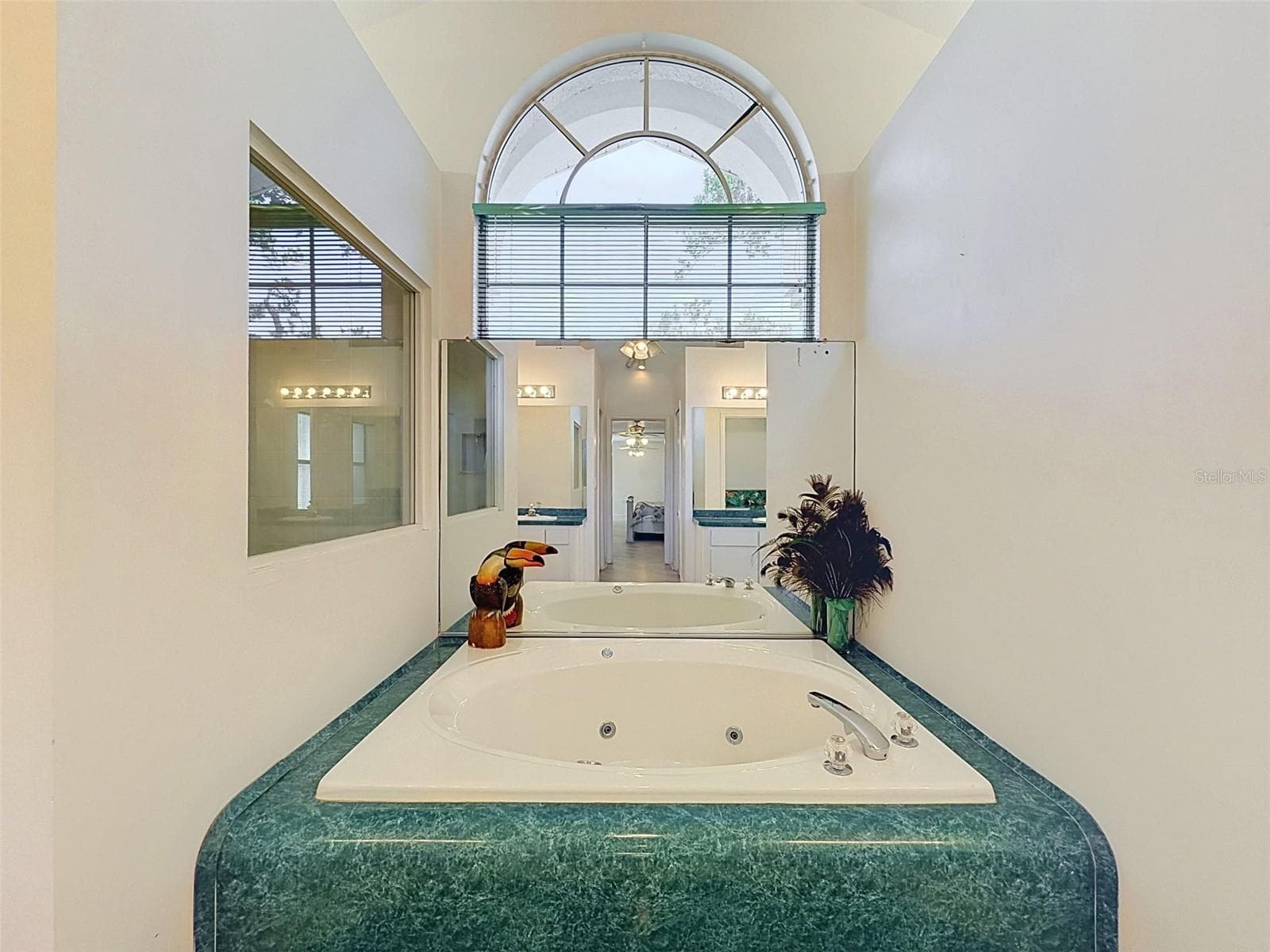 Owner's suite includes jetted tub, two WICs, linen closet, water closet, two vanities, and large shower. - 10074 SLEEPY WILLOW CT, SPRING HILL