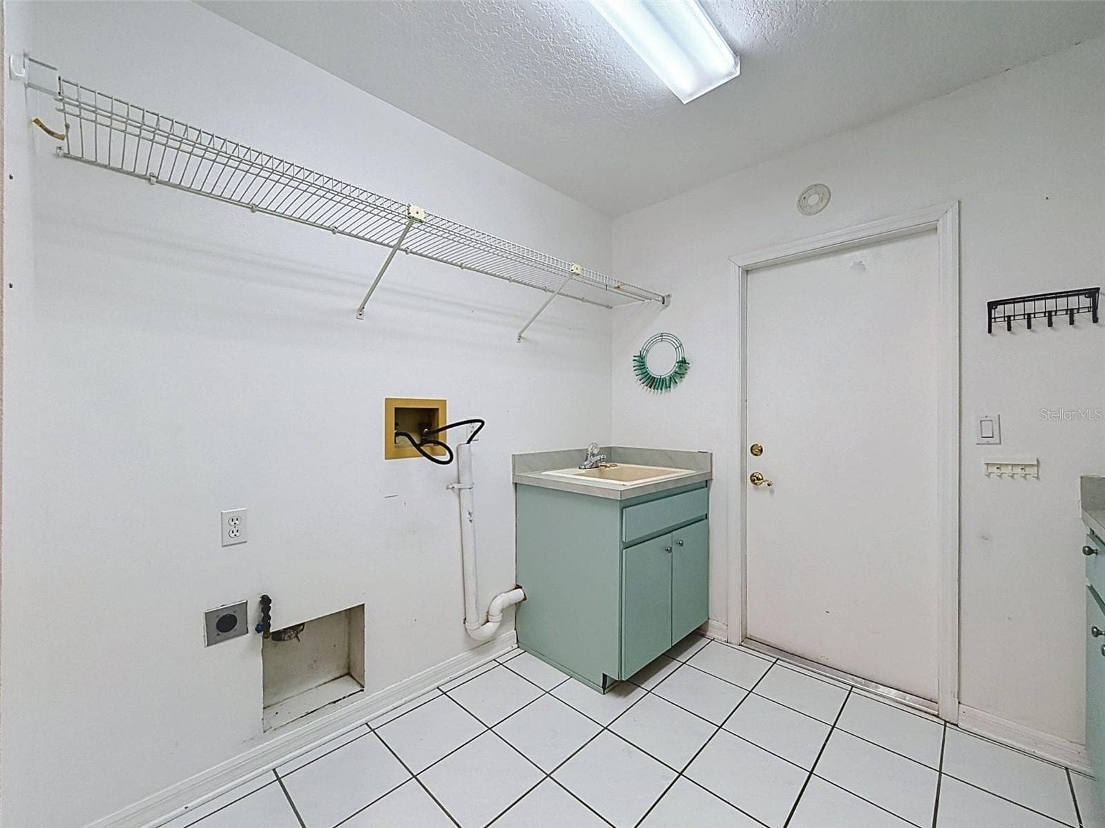 Laundry room has storage gallore! - 10074 SLEEPY WILLOW CT, SPRING HILL