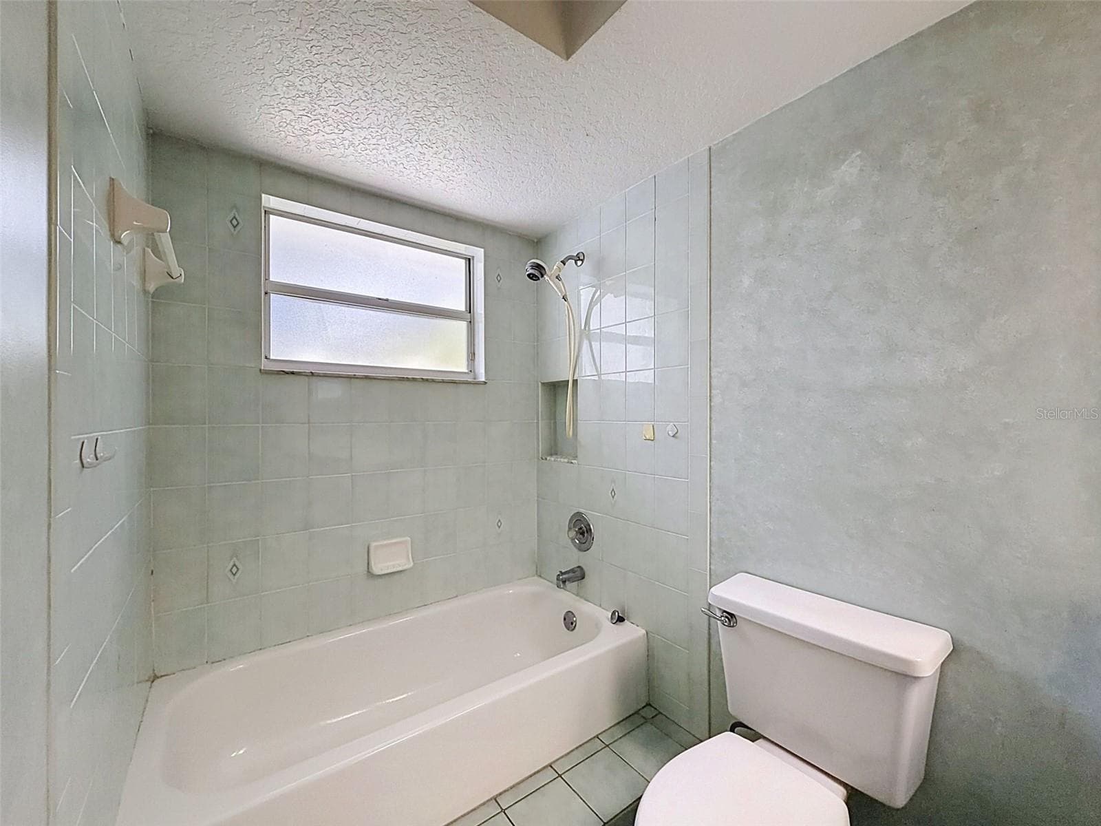 Hall bathroom is large with lots of storage. - 10074 SLEEPY WILLOW CT, SPRING HILL