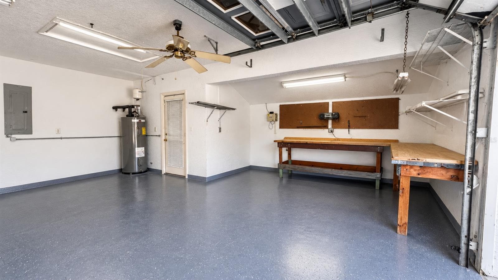 Virtually emptied garage so you can see the 8 x 12 shop area in the garage. - 10074 SLEEPY WILLOW CT, SPRING HILL
