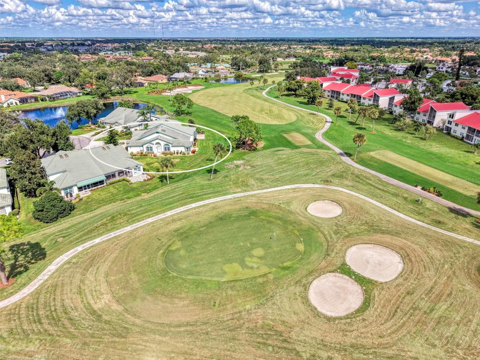 Looking out at 6th Green at Capri Isles Golf Course - 748 CONNEMARA CT, VENICE