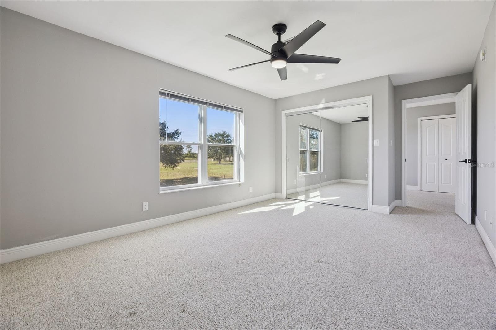 Bedroom #4 upstairs with a large closet and window. - 16131 JOHNS LAKE RD, CLERMONT