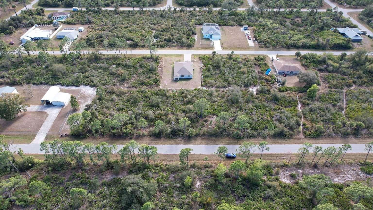 Aerial view of the lot and surrounding neighborhood; neighboring improvements are not included. - 12181 CONROY AVE, PORT CHARLOTTE