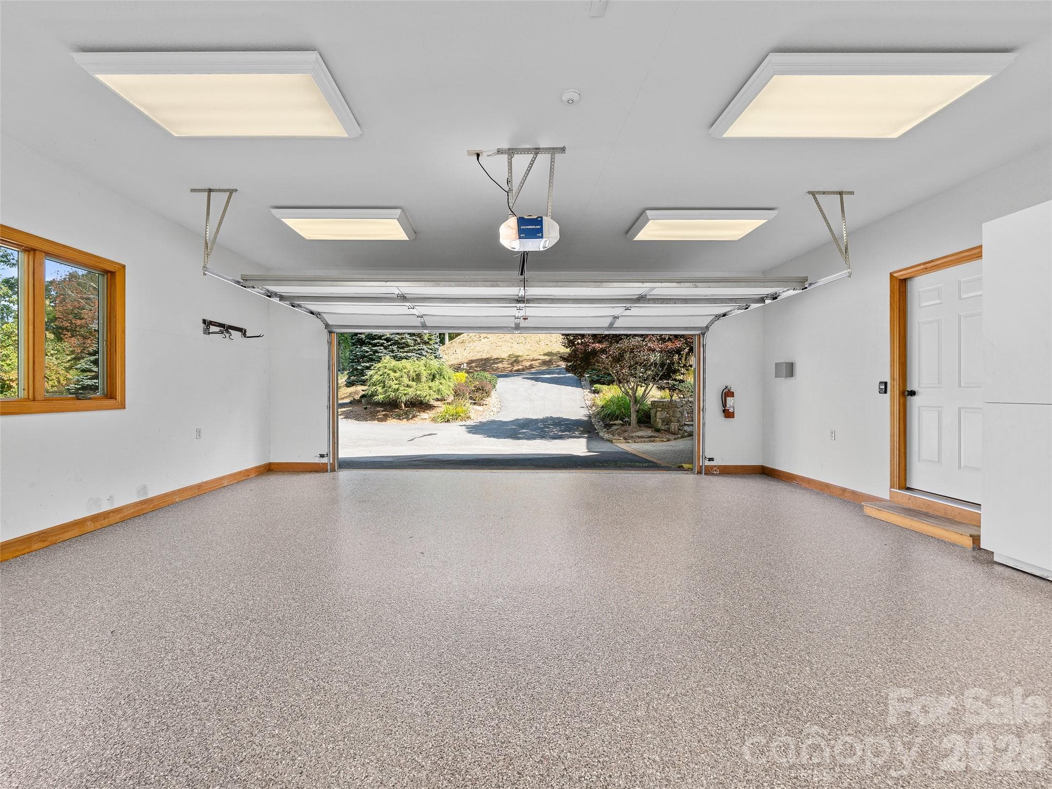 New epoxy flooring gives the garage a clean, polished finish - 151 Austin Mountain Drive, Burnsville