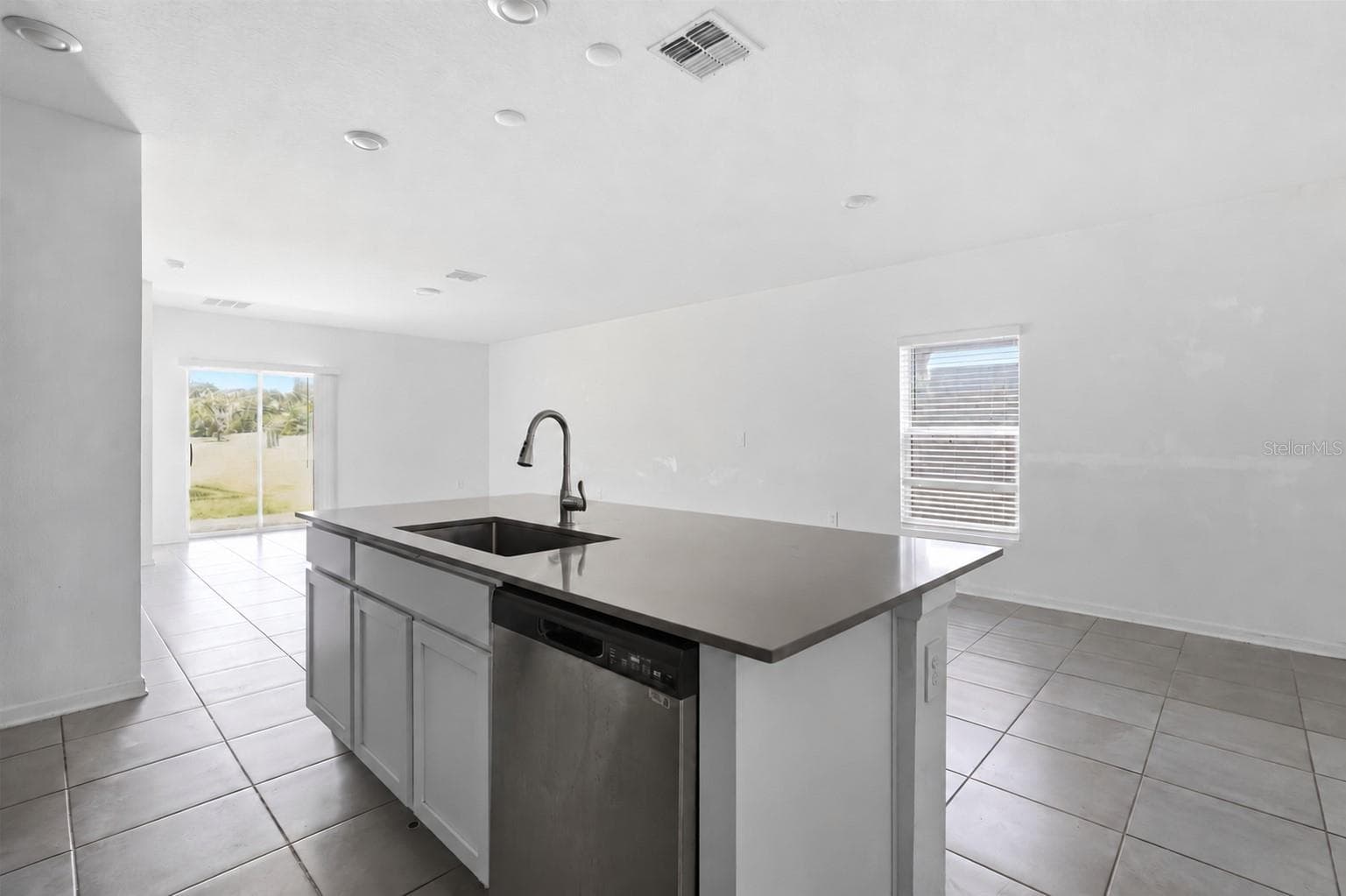 Kitchen comes with an island with stone counters - 418 COOL SUMMER LN, DAVENPORT
