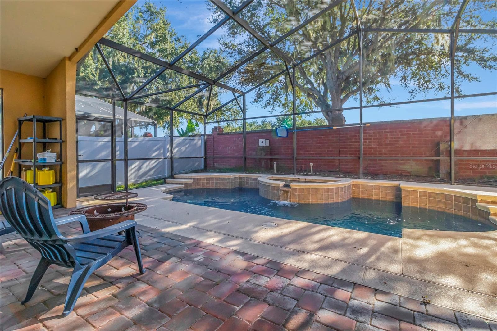 Water fall feature into the pool - 4877 GRASSY KNOLL DR, TAVARES