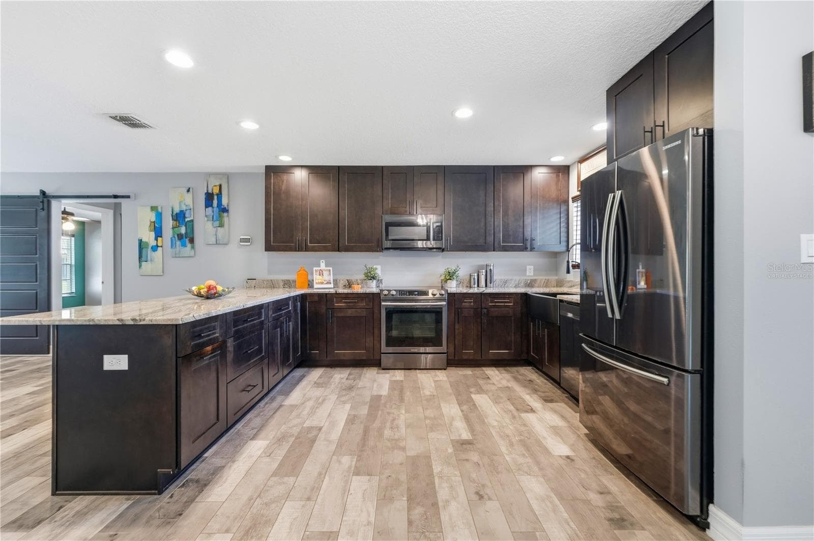Kitchen with Generous Storage and prep space. - 10702 WILLIAM TELL DR, ORLANDO