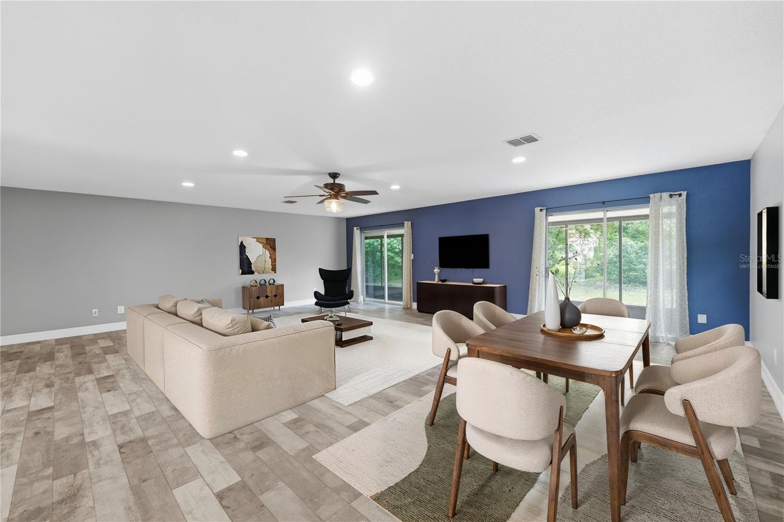 Living Room Dining Combo. Virtually Staged furniture - 10702 WILLIAM TELL DR, ORLANDO