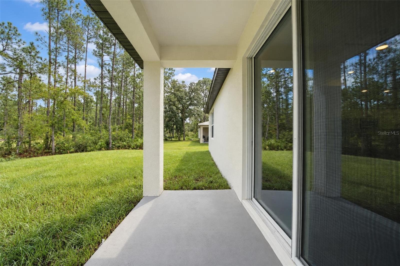 Covered back patio - 9107 OVIEDO ST, SEBRING