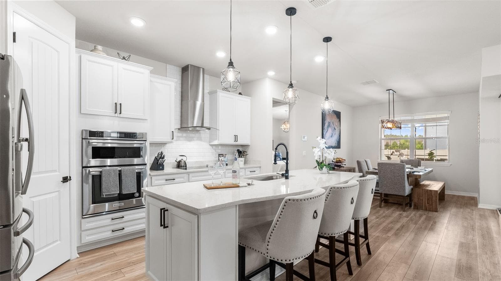 Kitchen: Expansive Island With Seating, Built-In Oven/Microwave, Range Hood, Cooktop - 19234 MOSSY PINE DR, TAMPA