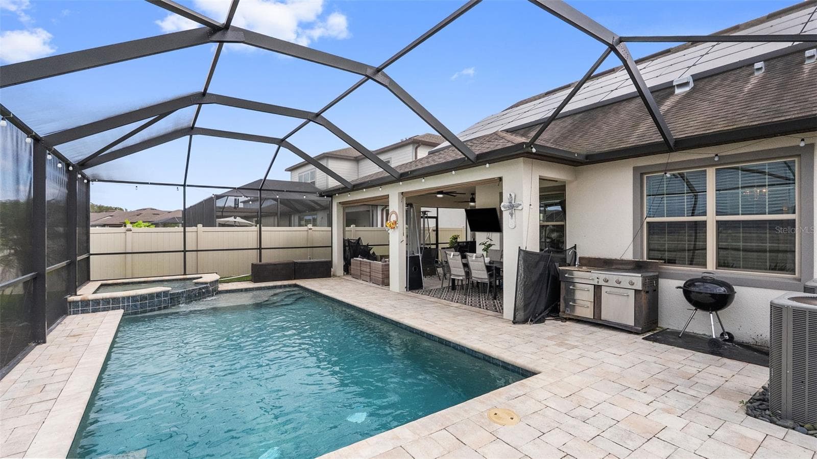 Lanai: Outdoor Kitchen Featuring Utility Sink & Grill - 19234 MOSSY PINE DR, TAMPA