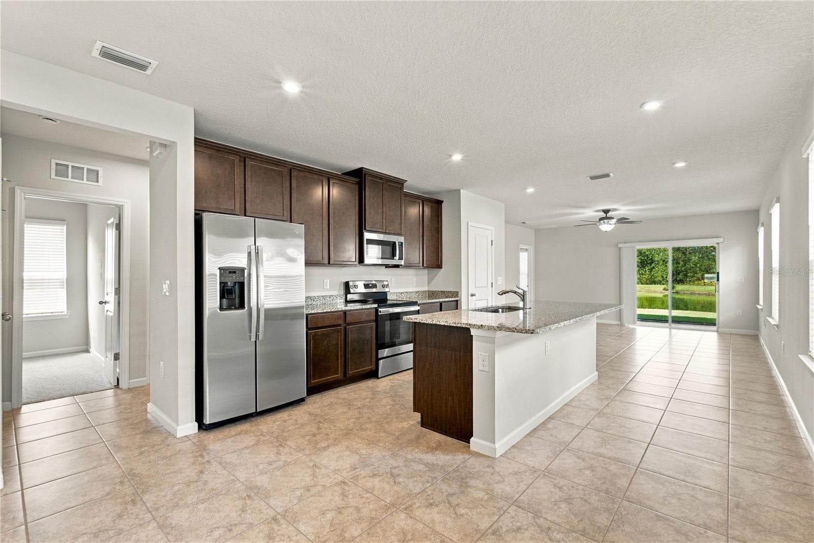 Kitchen from Foyer - 17973 DAIRY FARM CT, LAND O LAKES