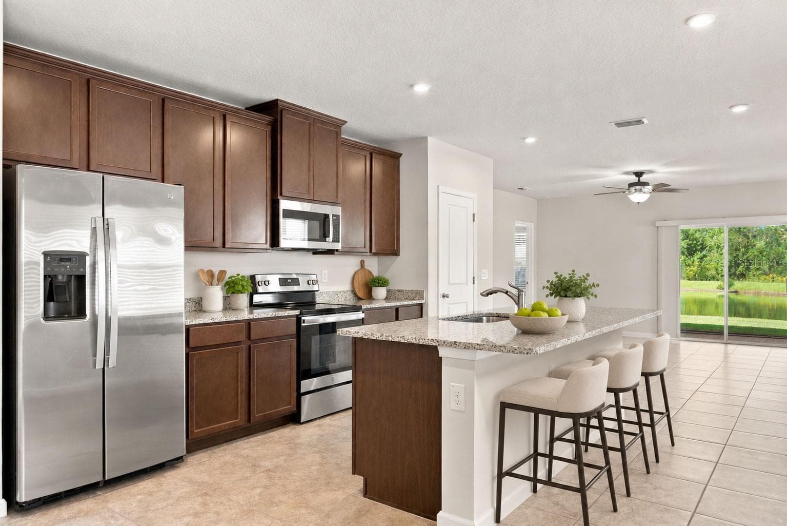 Kitchen with Barstools - 17973 DAIRY FARM CT, LAND O LAKES