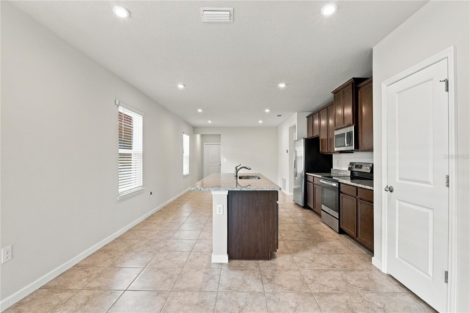 Kitchen from Family Room - 17973 DAIRY FARM CT, LAND O LAKES