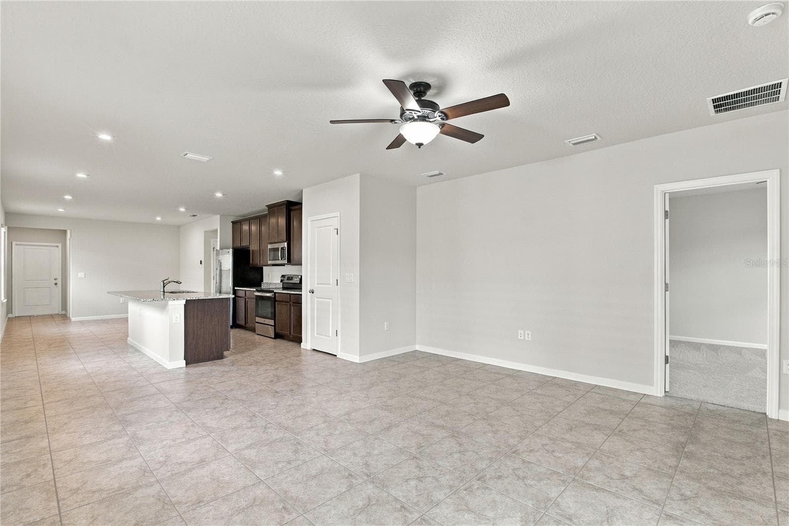 Open Plan from Sliding Glass Door - 17973 DAIRY FARM CT, LAND O LAKES
