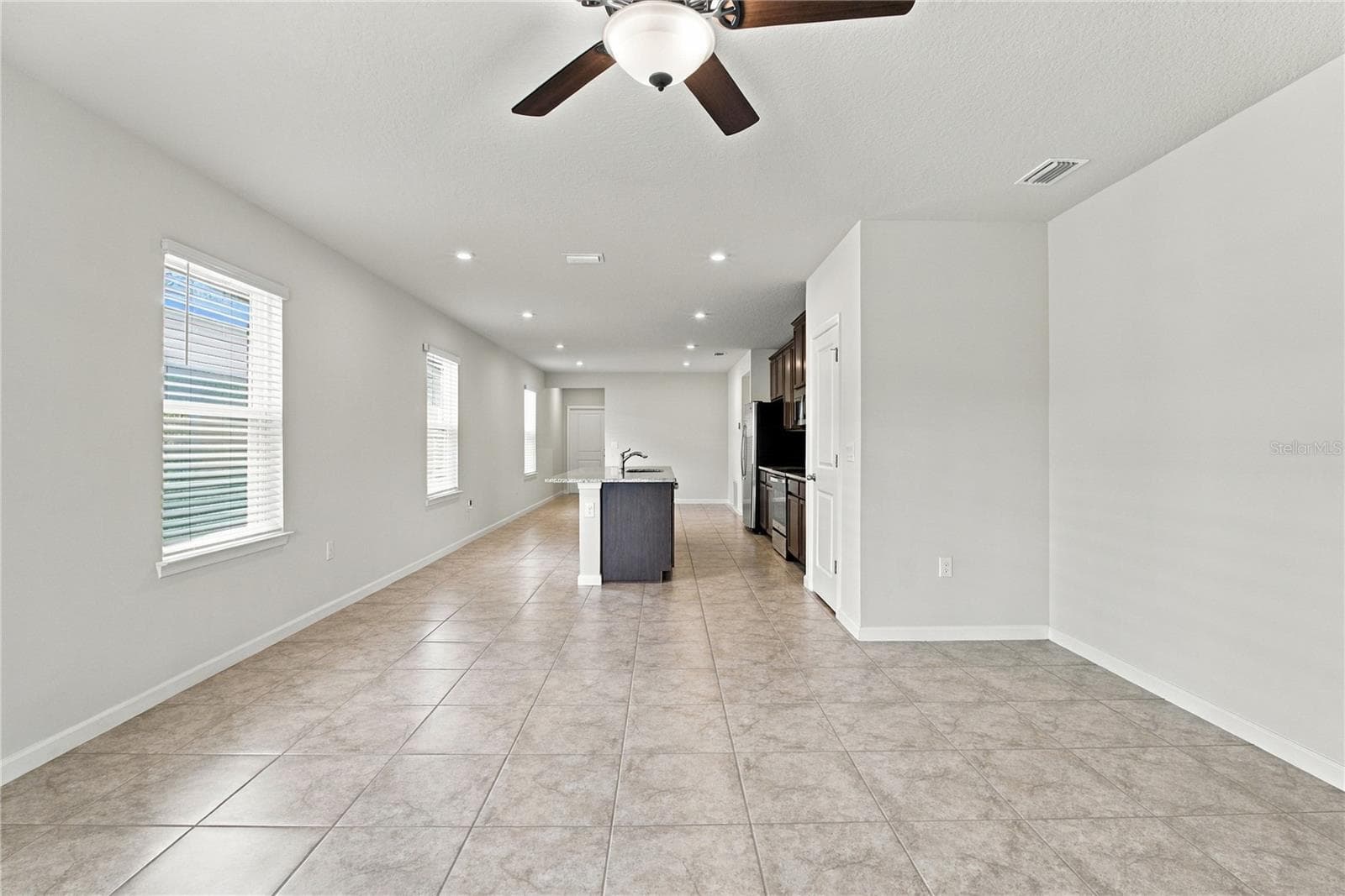 Open Floor Plan from Family Room Perspective - 17973 DAIRY FARM CT, LAND O LAKES