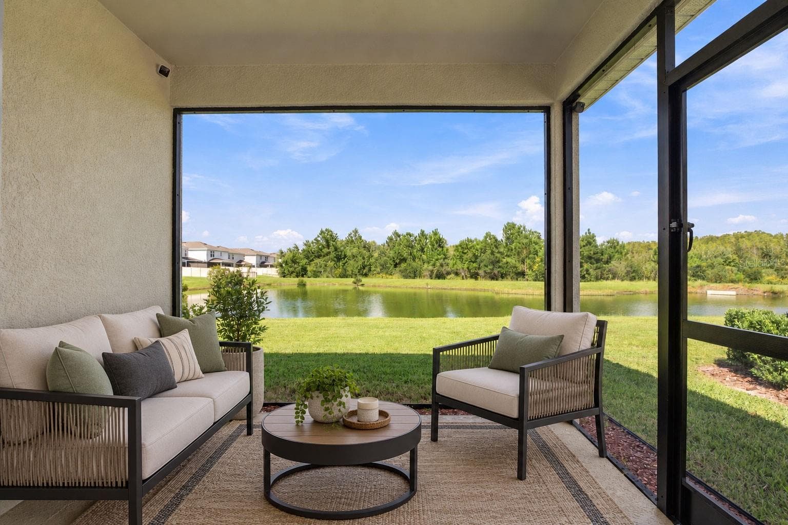 Screened Porch Area with Furniture - 17973 DAIRY FARM CT, LAND O LAKES
