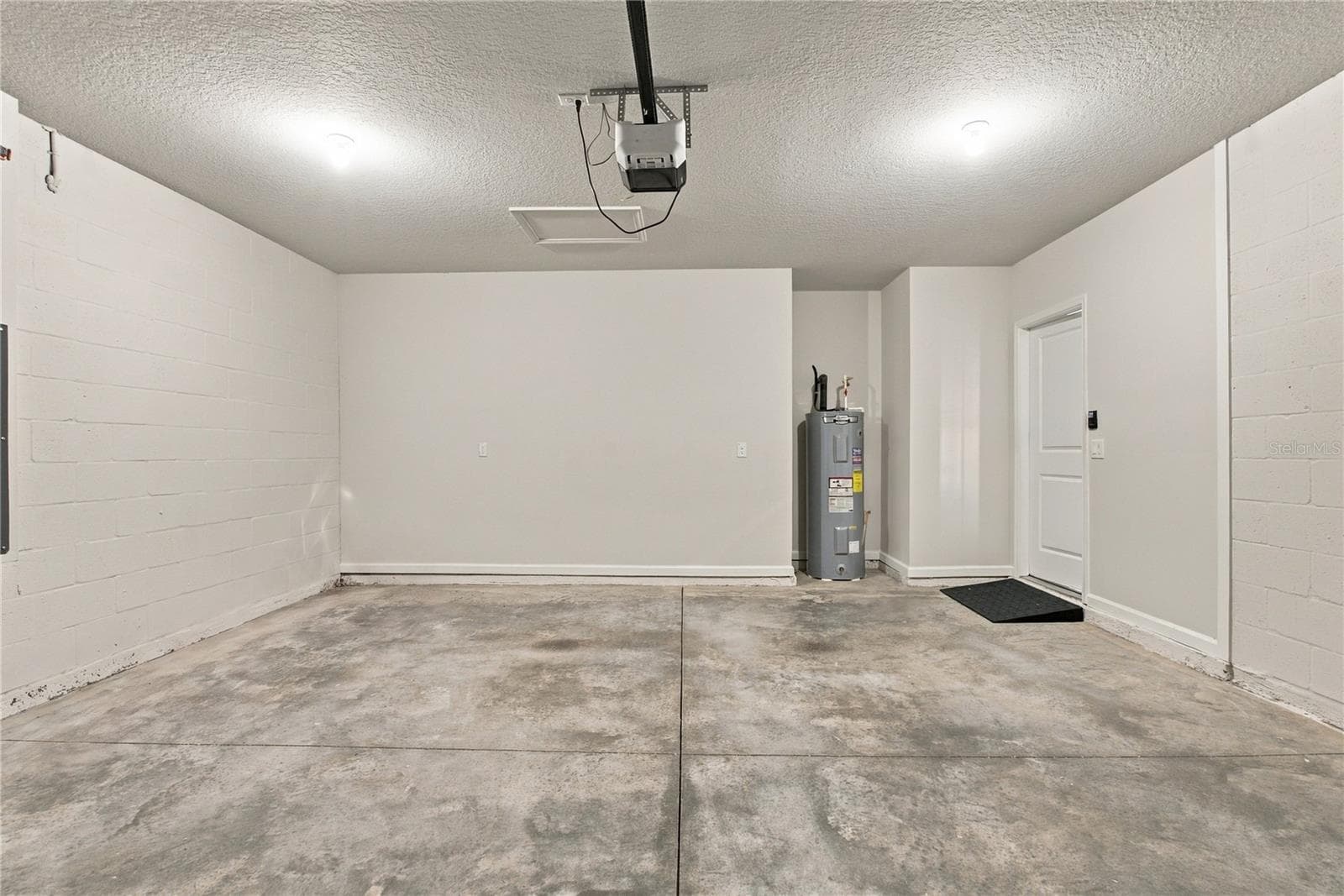 2 Car Garage View from Garage Door Perspective - 17973 DAIRY FARM CT, LAND O LAKES