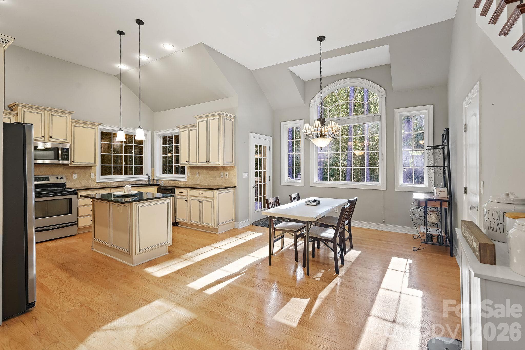 Convenient dining area overlooks the wooded backyard - 1491 Woodbend Court, Stanley