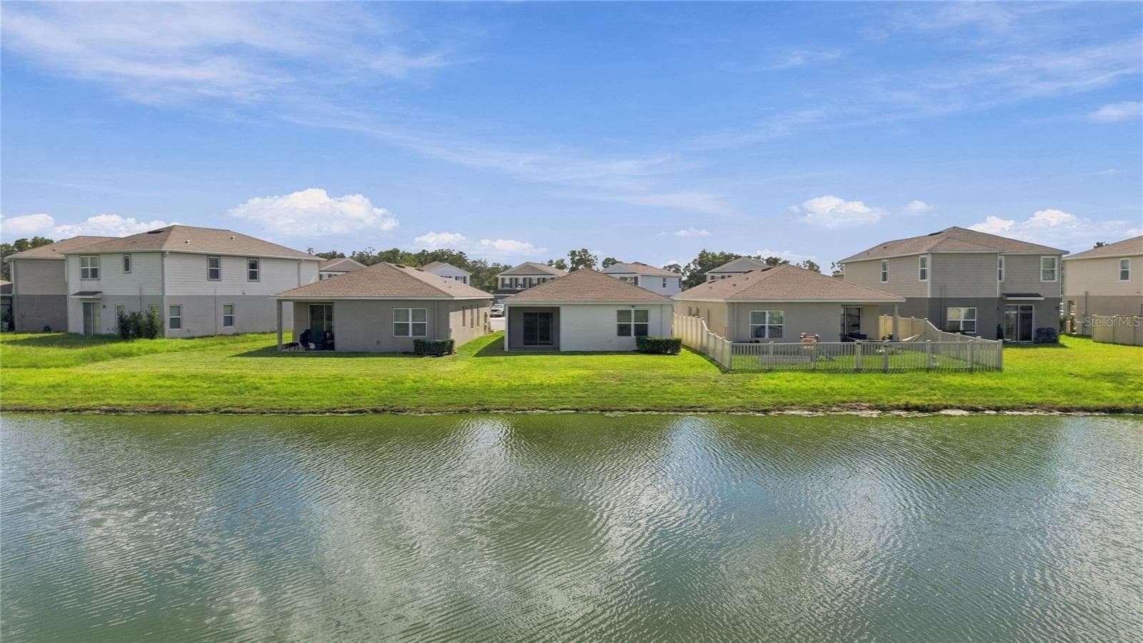 Home viewed from across the Lake - 17973 DAIRY FARM CT, LAND O LAKES