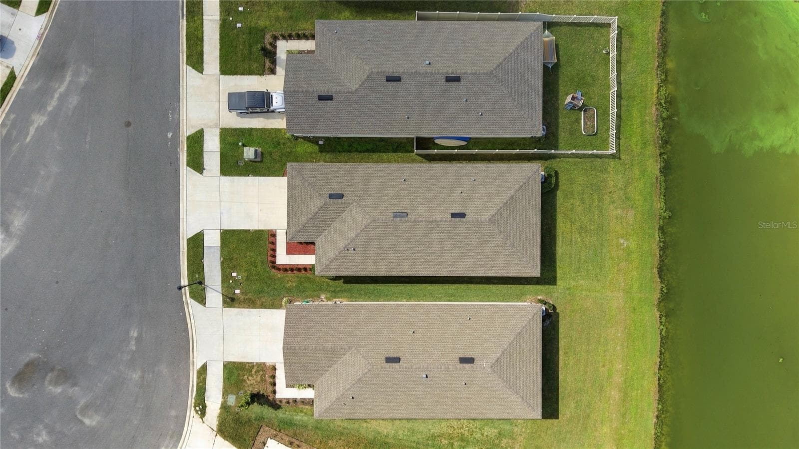 Drone View From Side Perspective - Home is middle one - 17973 DAIRY FARM CT, LAND O LAKES