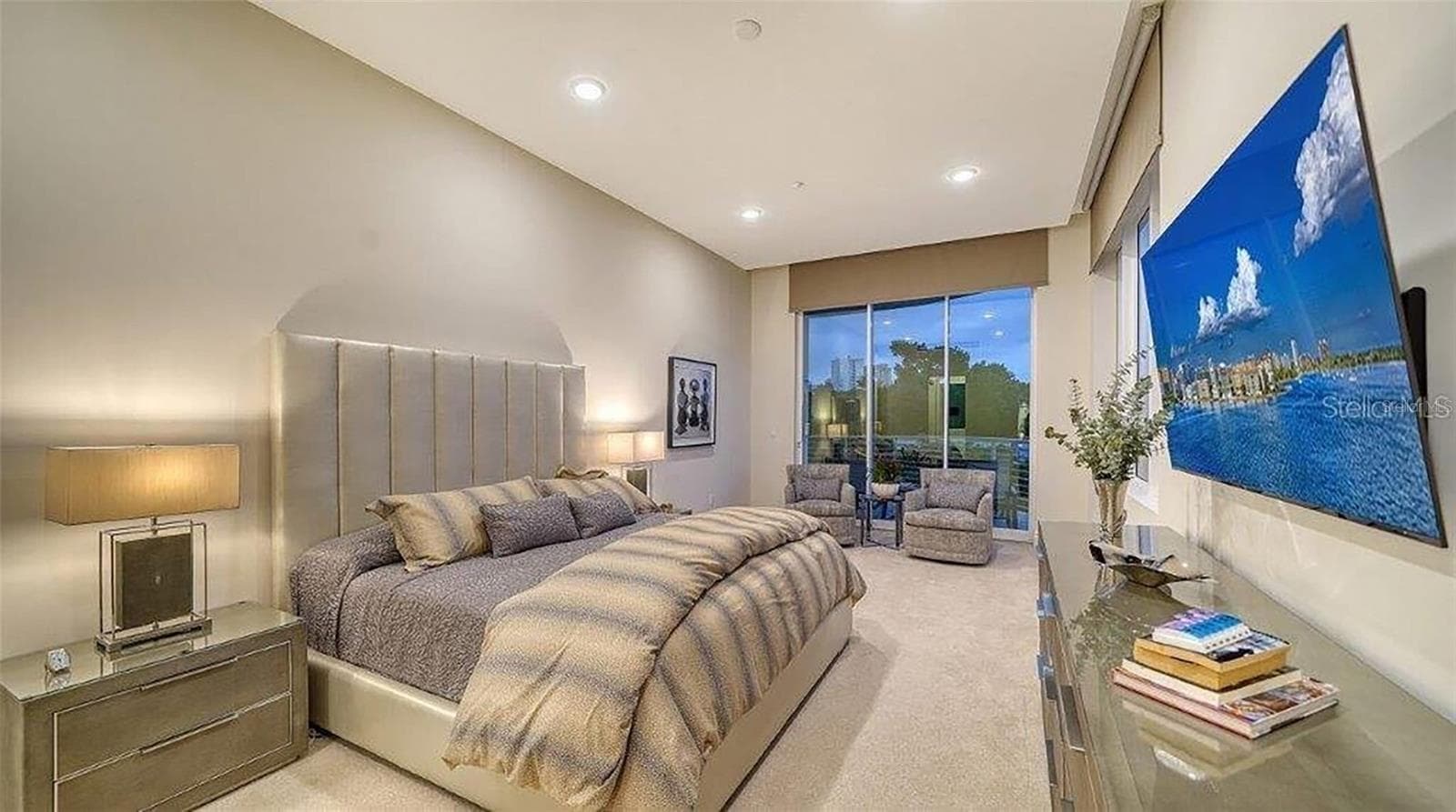 Primary bedroom previously furnished evening shot - 609 GOLDEN GATE PT #301, SARASOTA