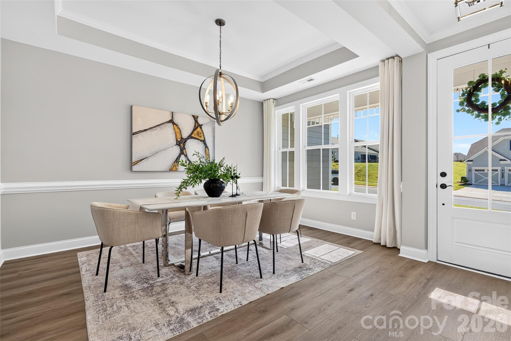 Private Dining Room with tray ceiling and upgraded lighting as well as low maintenance vinyl flooring - 13413 Cozy Court, Charlotte
