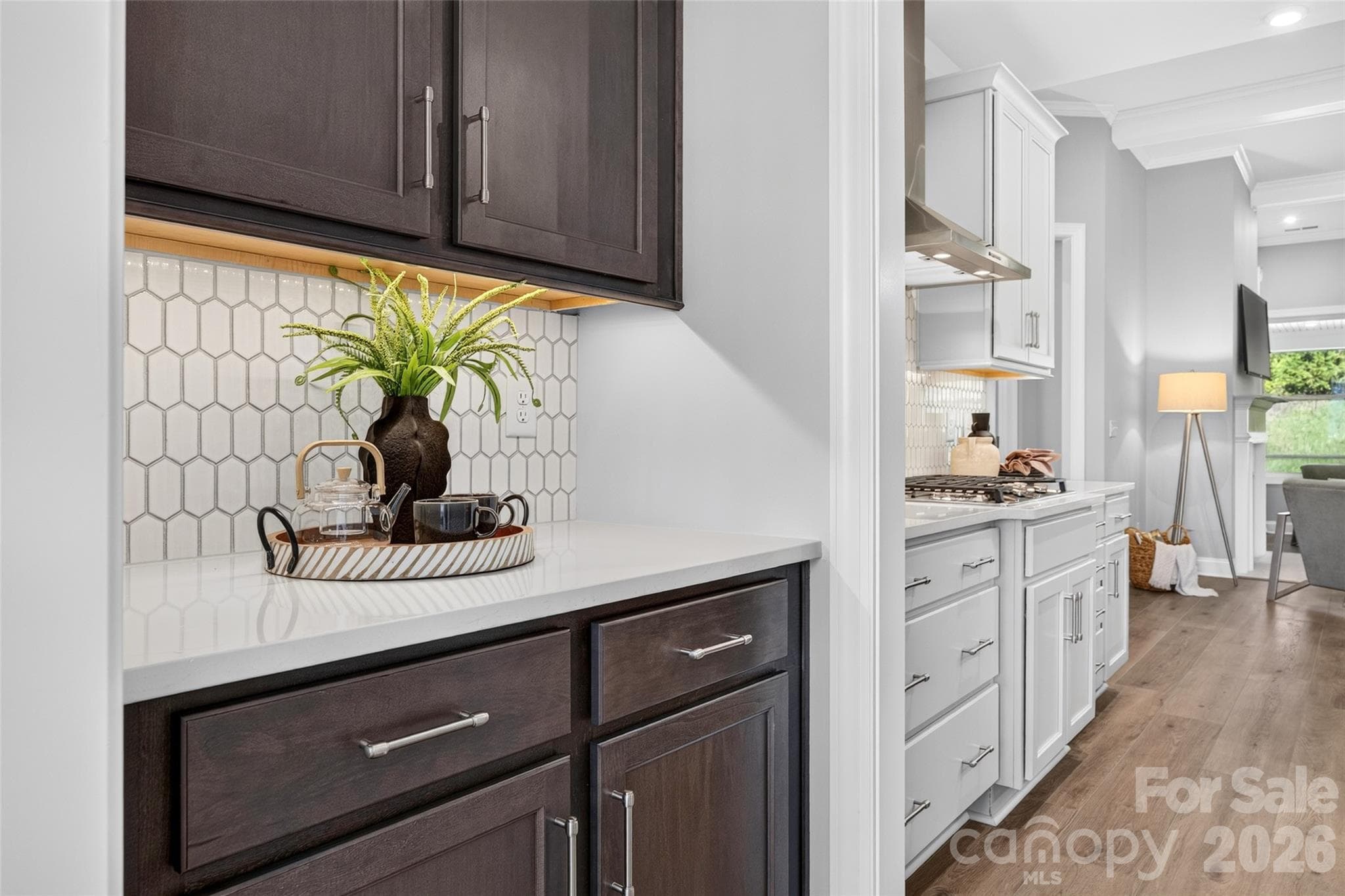 Butlers Pantry with custom tile backsplash, quartz counter and undermount lighting make this space both attractive and functional - 13413 Cozy Court, Charlotte