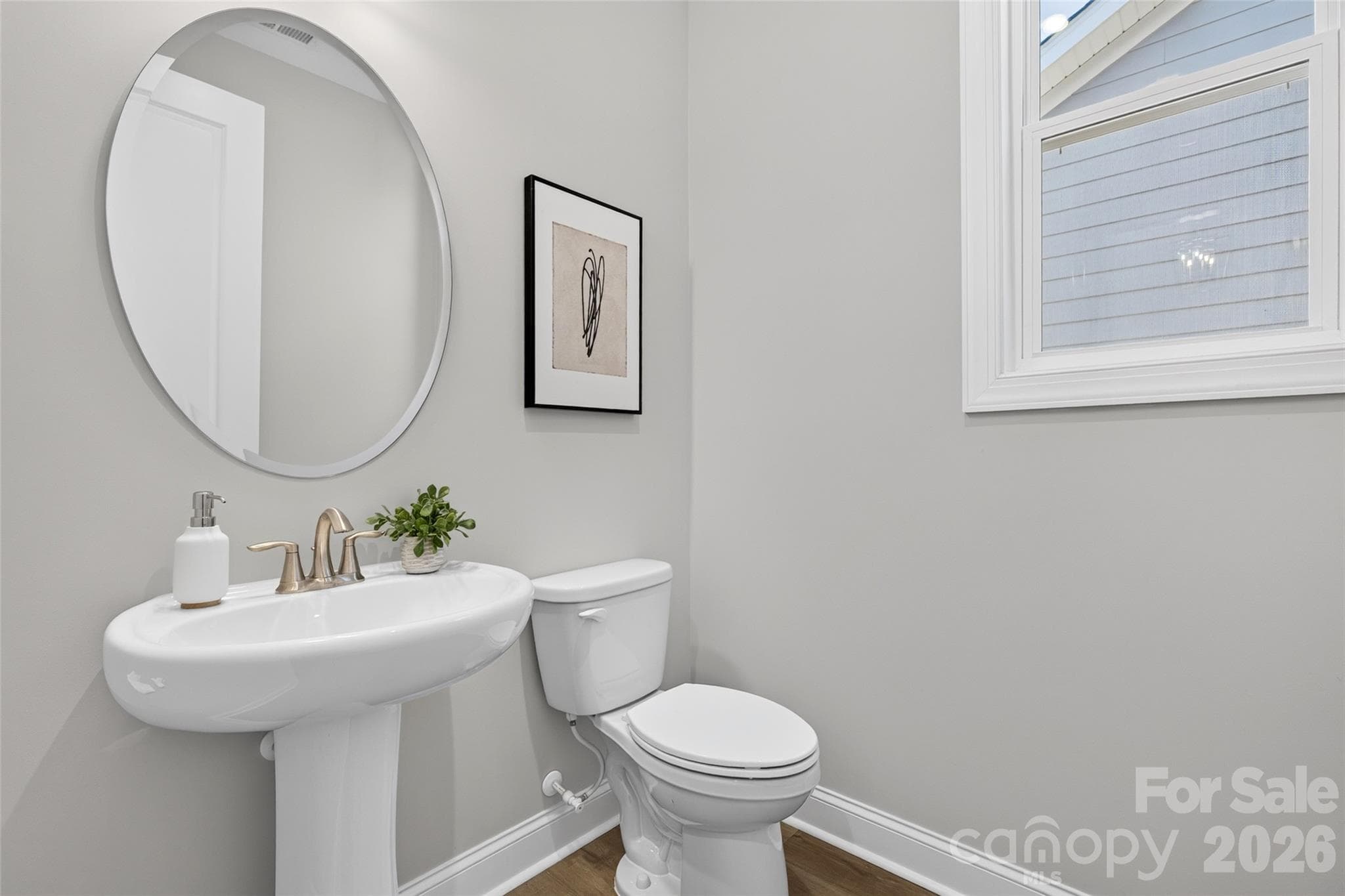 Powder Room with pedestal sink conveniently located for your guests - 13413 Cozy Court, Charlotte