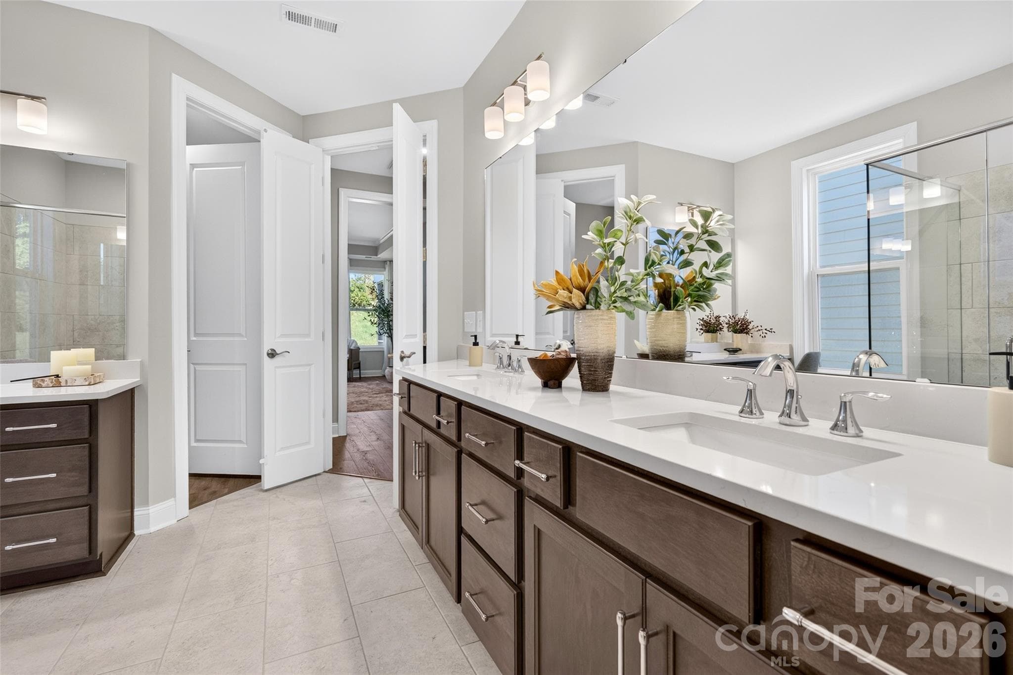Dual vanity with rectangular sinks and quartz counters in Primary ensuite bath - 13413 Cozy Court, Charlotte