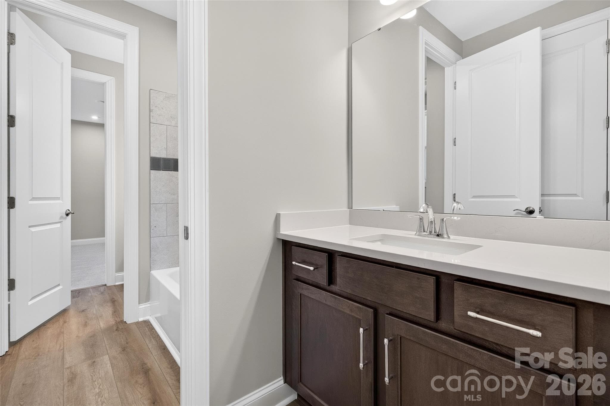 Shared "Jack and Jill" Bathroom conveniently located between both secondary bedrooms - 13413 Cozy Court, Charlotte
