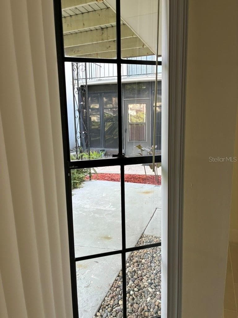 Side window overlooking Bedroom 2 patio - 5999 VILLAGE CIR #990, ORLANDO