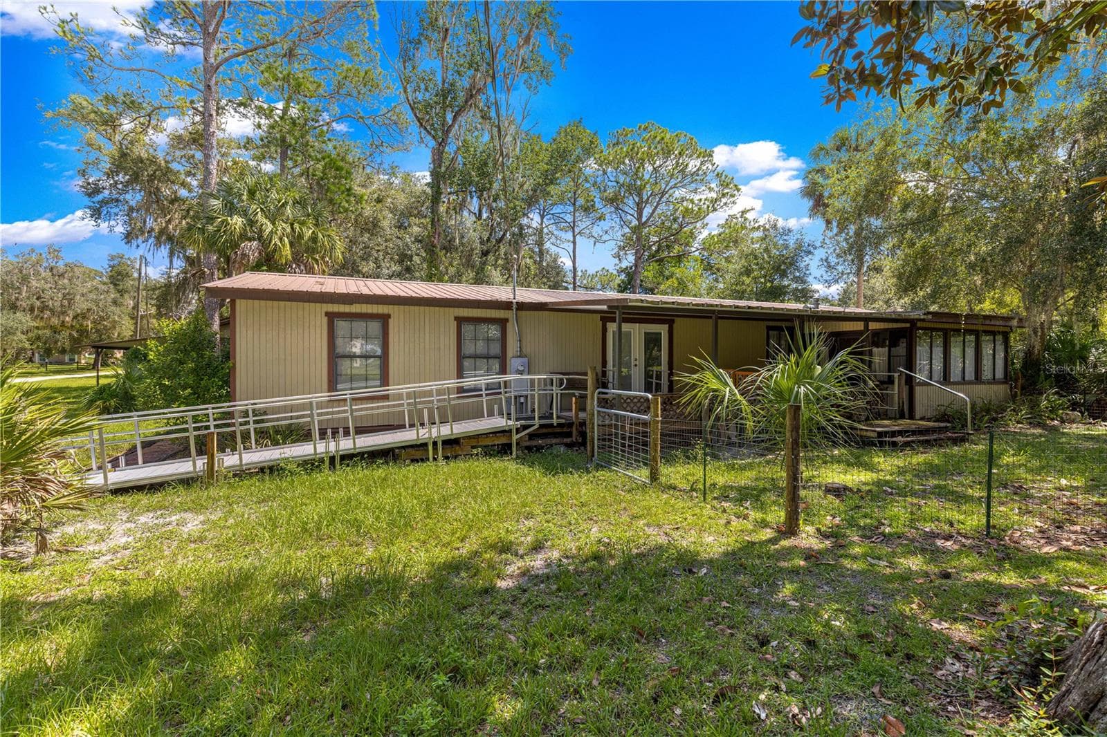 #1 · Main residence and ramp entry. - 7434 E CABIN LN, INVERNESS