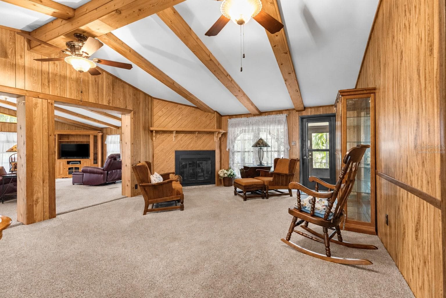 #1 · Fireplace sitting area. Virtually staged—personal items digitally removed. - 7434 E CABIN LN, INVERNESS