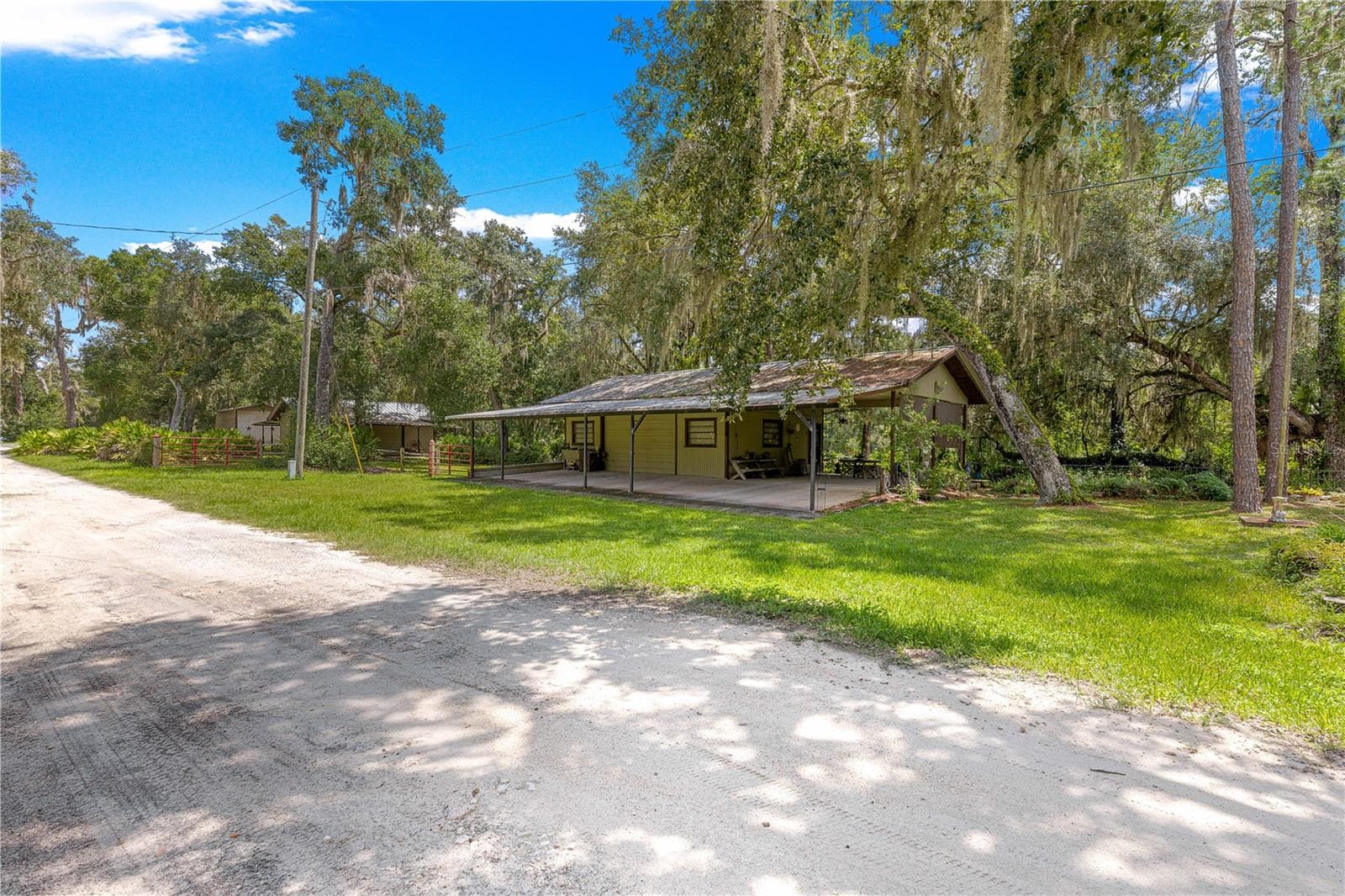 #2 · Mechanic’s shop exterior and covered areas. - 7434 E CABIN LN, INVERNESS