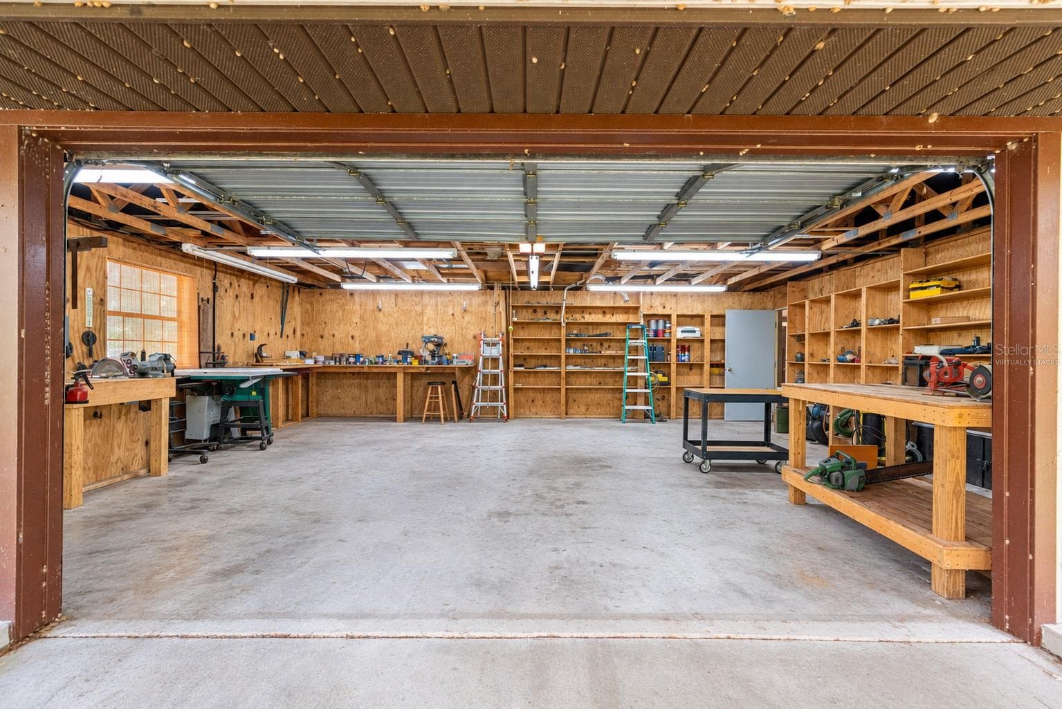 #3 · Woodworking shop interior. Virtually staged—personal items digitally removed. - 7434 E CABIN LN, INVERNESS
