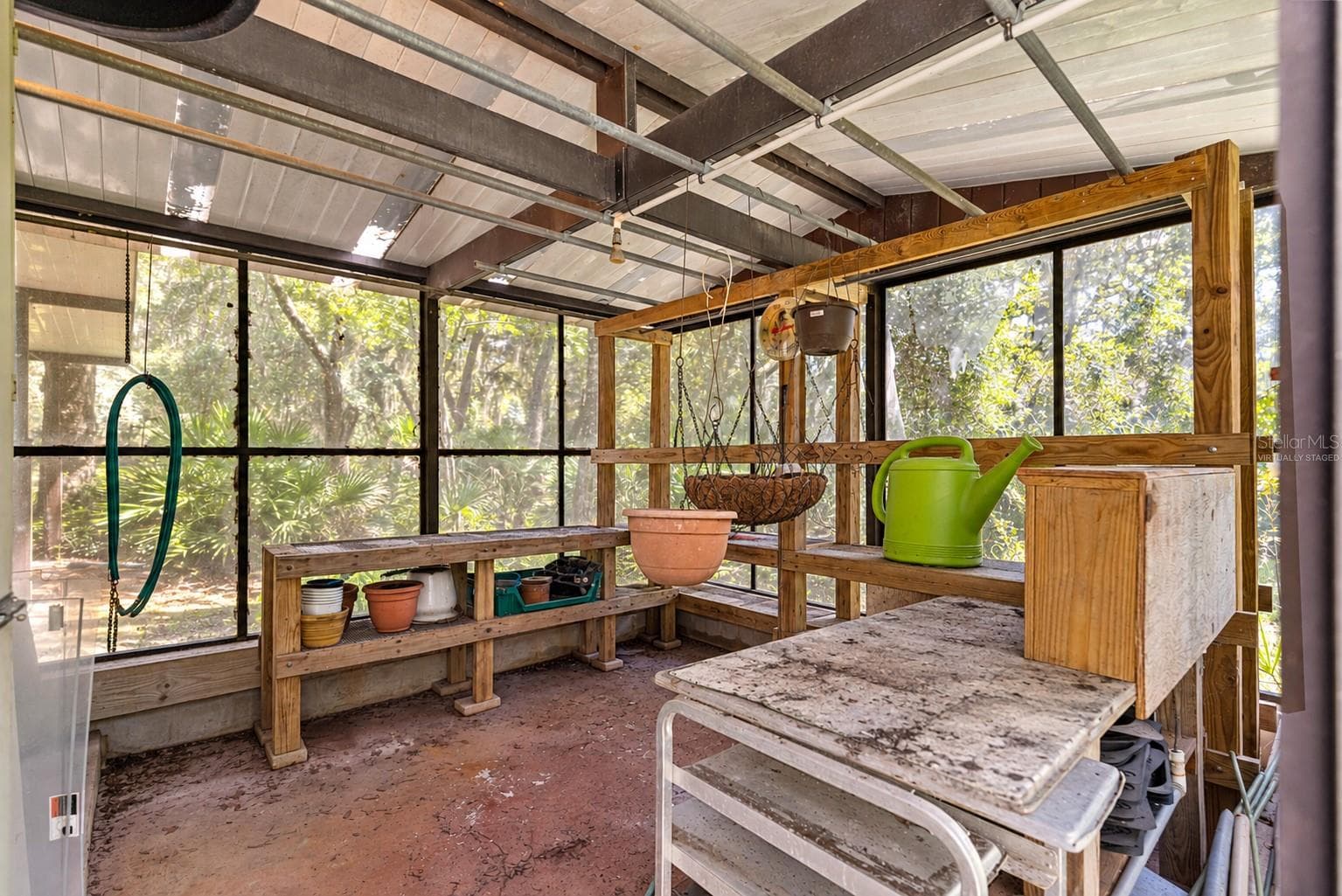 #3 · Greenhouse attached to the woodworking shop. Virtually staged—personal items digitally removed. - 7434 E CABIN LN, INVERNESS