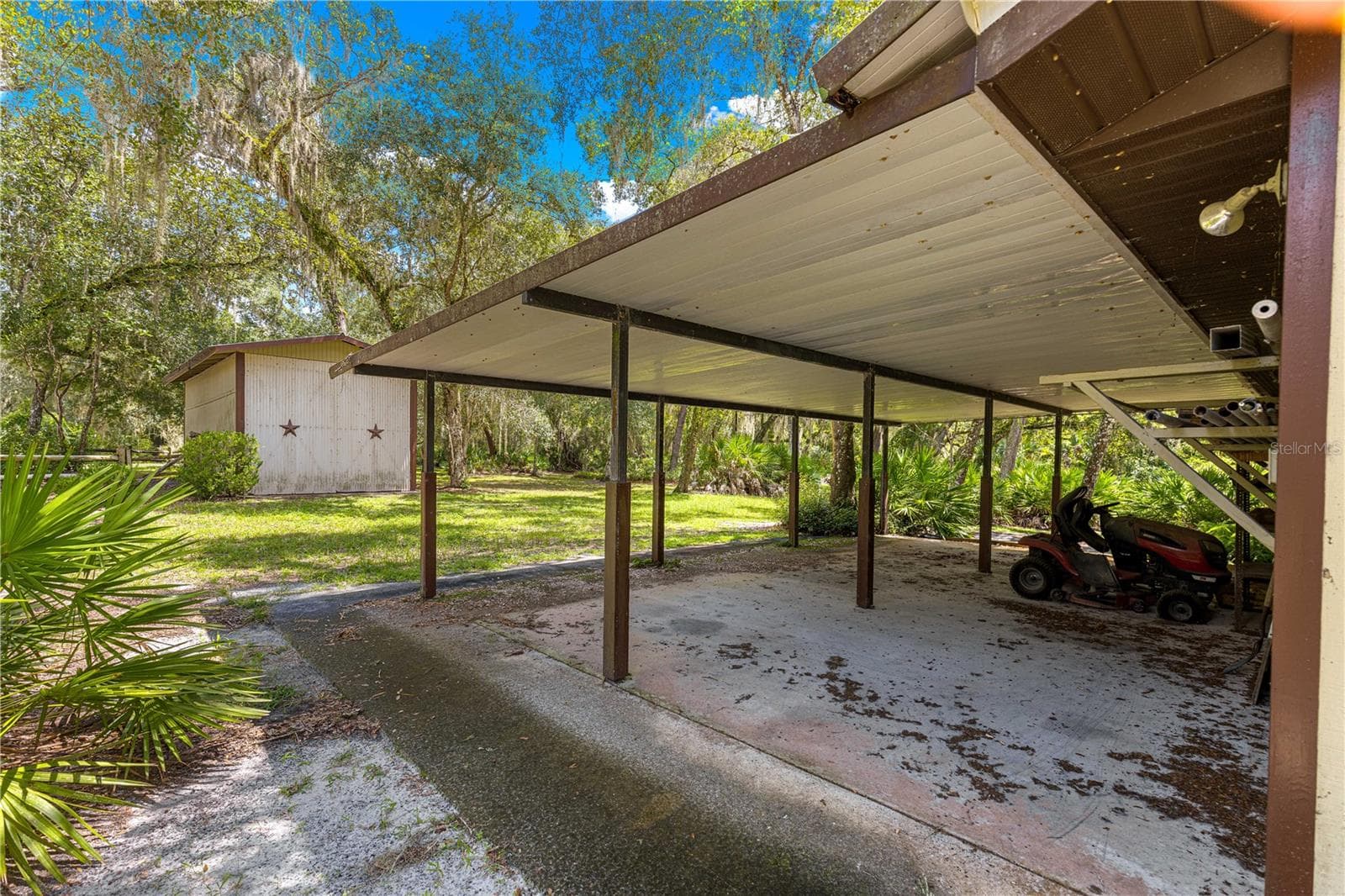 #4 · Separate star-front RV/toy storage building beyond the covered parking. - 7434 E CABIN LN, INVERNESS