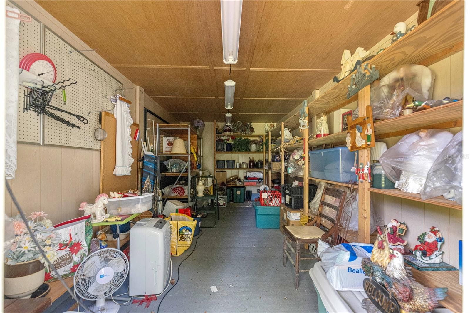 #7 · She shed interior, with existing shelving and equipment. - 7434 E CABIN LN, INVERNESS