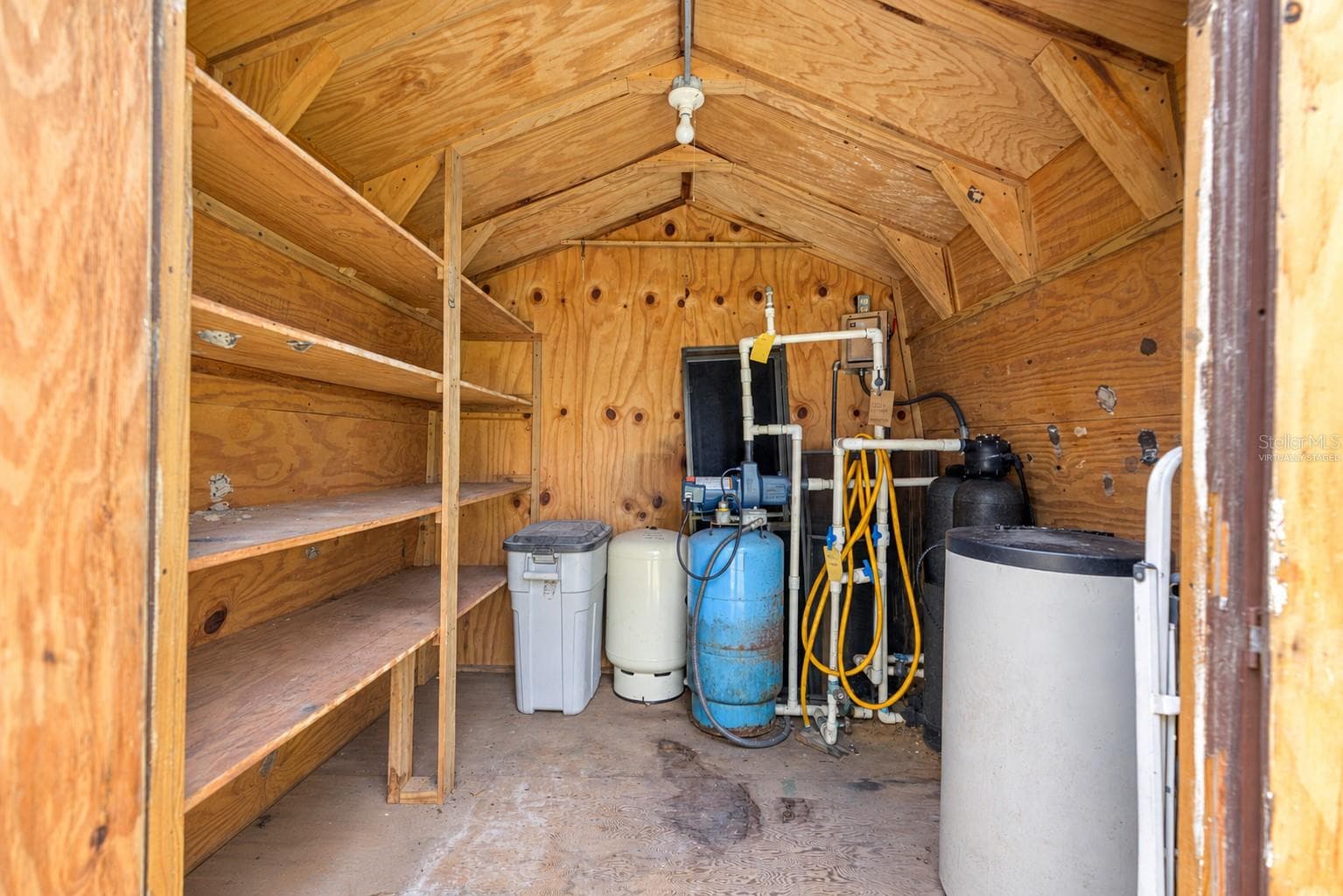 #5 · Well house / water filtration: interior equipment. Virtually staged—personal items digitally removed. - 7434 E CABIN LN, INVERNESS