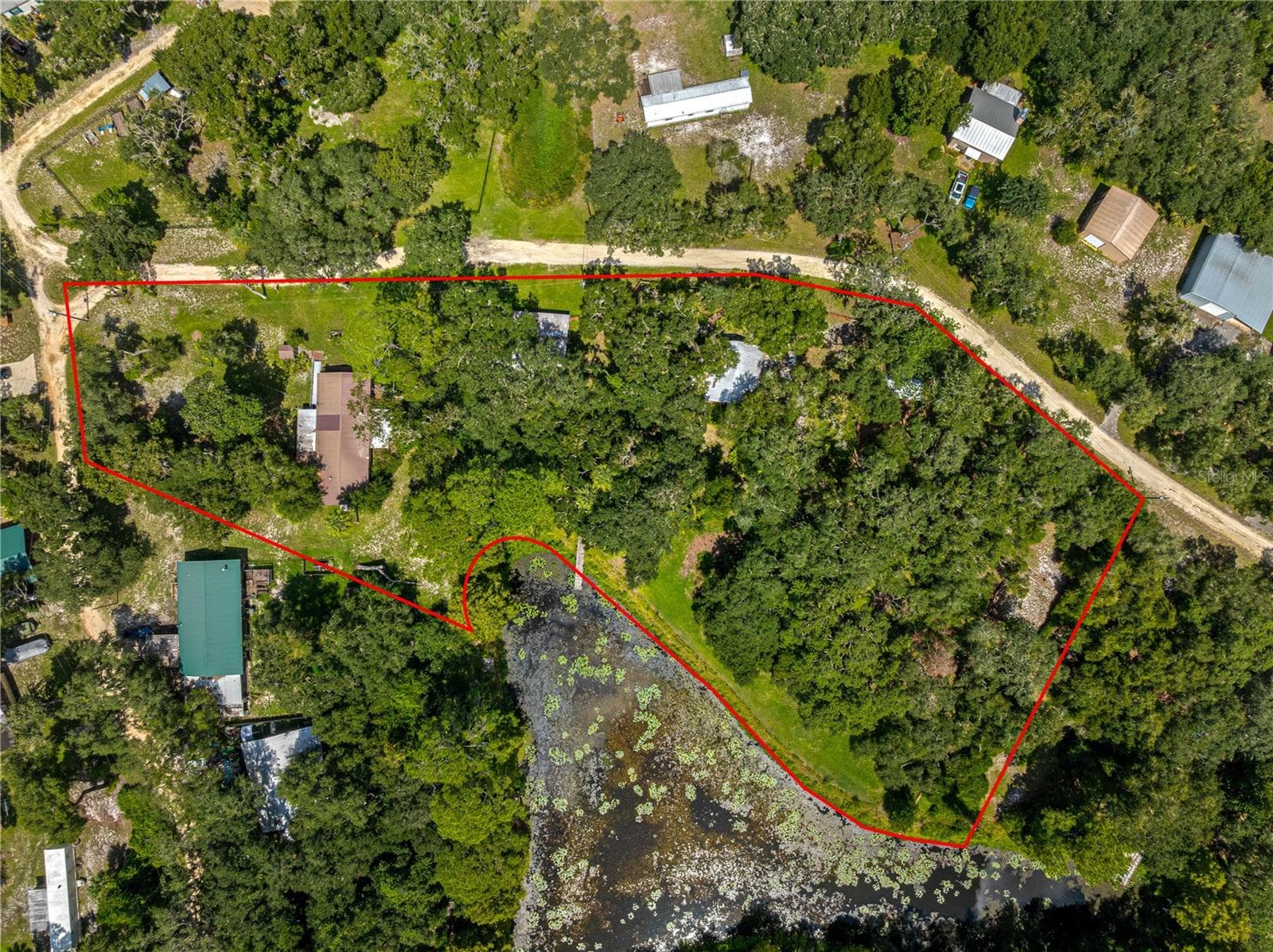 Aerial orientation. Existing red outline is approximate, not a surveyed or verified boundary. - 7434 E CABIN LN, INVERNESS