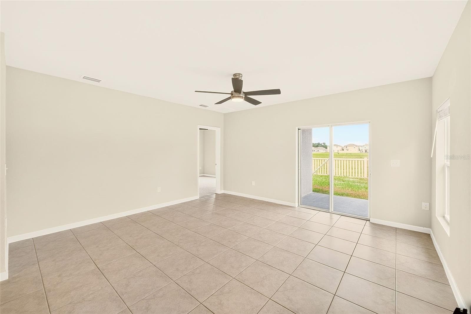 GREAT ROOM WITH SLIDERS TO LANAI - 35235 GENDRY ST, ZEPHYRHILLS