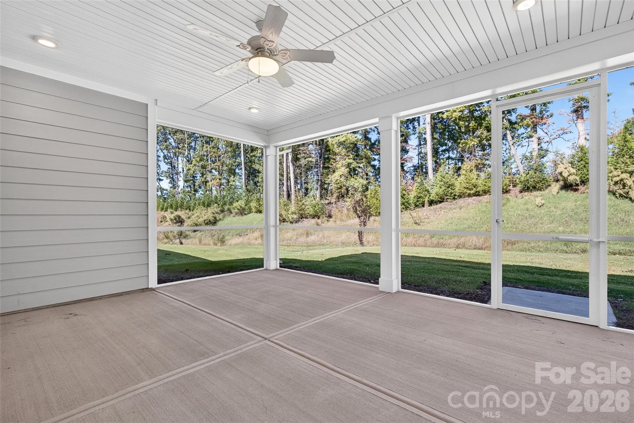 Oversized screened rear porch with ceiling fan and added recessed lights - 13413 Cozy Court, Charlotte