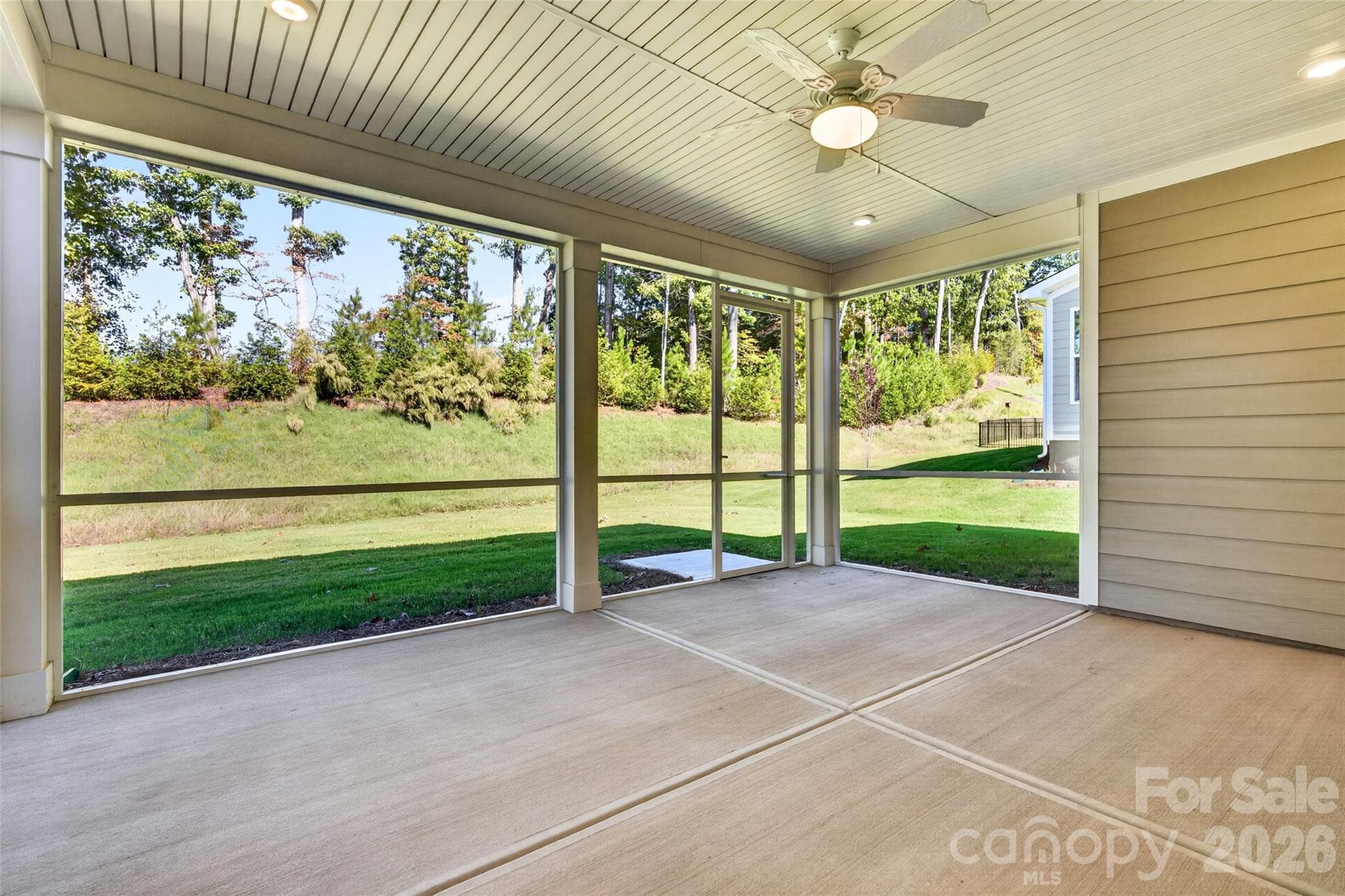 Extended screened rear porch overlooks private yard - with no house behind - 13413 Cozy Court, Charlotte