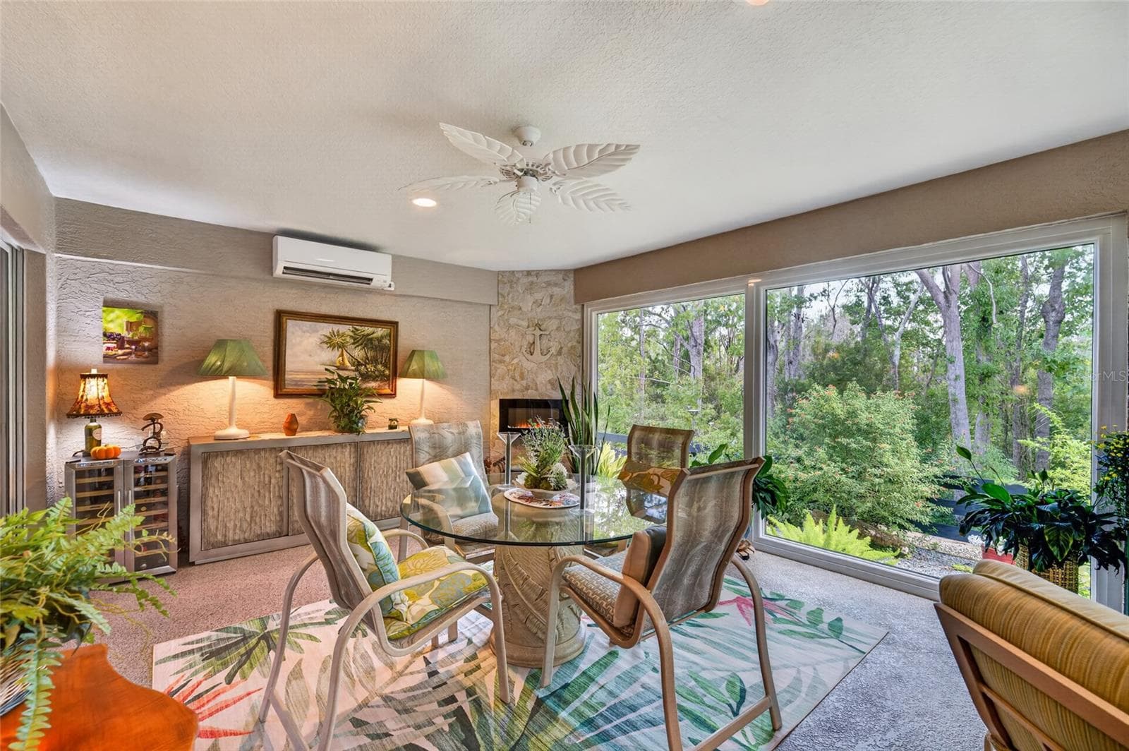 Enclosed lanai features fireplace and mini-split for comfort. - 3665 VALLEYBROOK WAY, THE VILLAGES